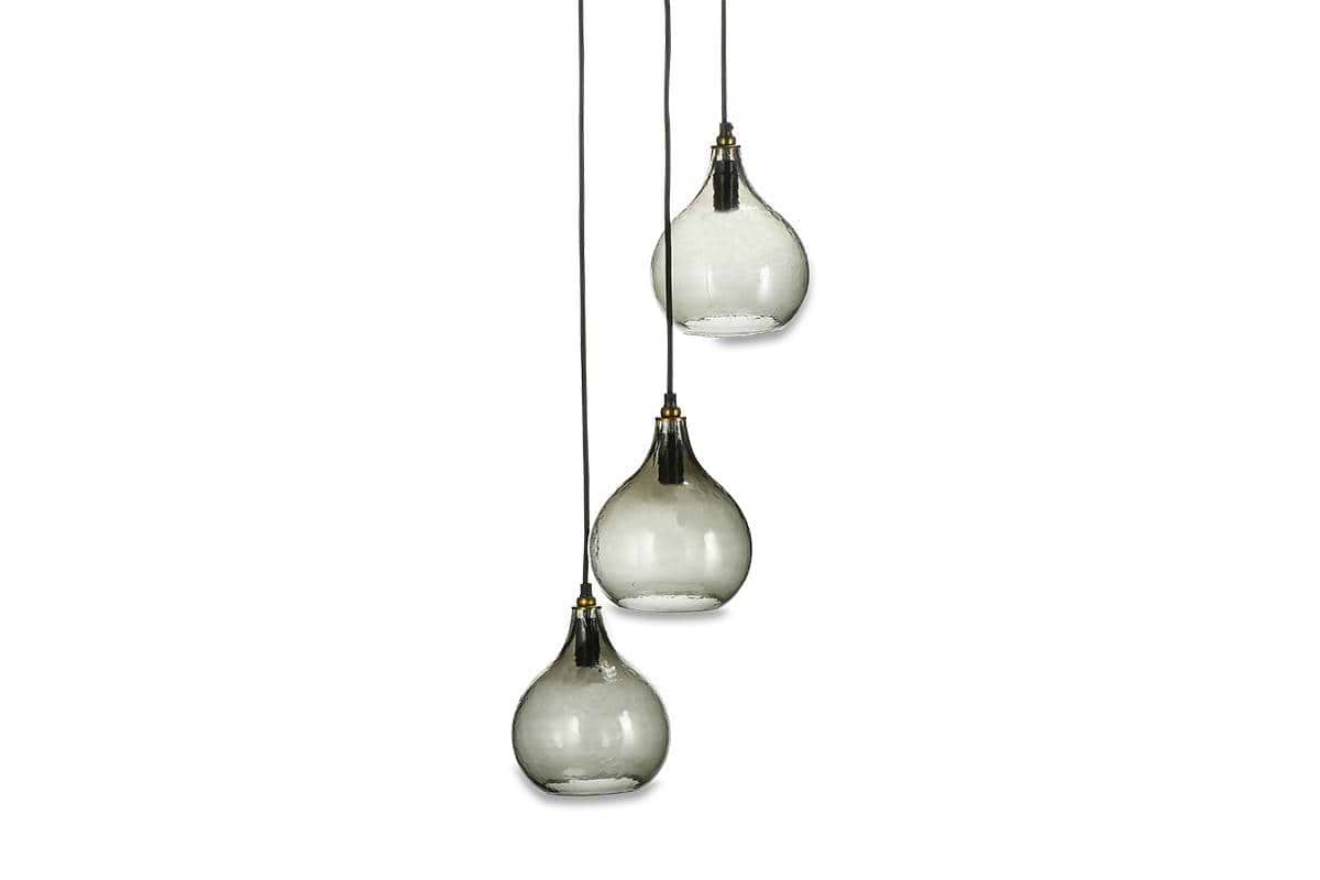 The nkuku Ziva Recycled Glass Cluster Pendant in Green Smoke features three adjustable modern glass lights with smoky teardrop shades and brass accents, hanging at different heights for a chic, contemporary look.