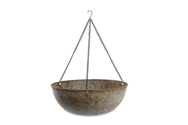 The nkuku Abari Round Hanging Planter is a large, weathered metal piece with visible rust, hanging from three iron chains and a central hook—ideal for outdoor use and shown against a plain white background.