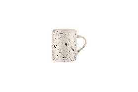 The nkuku Ama Mug - Tall features a white ceramic base with unique black speckles and splatter, highlighting the distinctive artistry of the Ama collection.