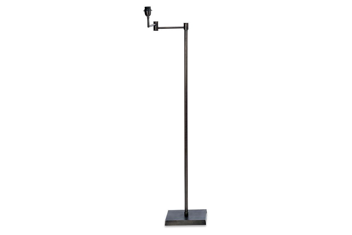 The Kara Iron Floor Lamp by nkuku features a slim, straight bronze iron pole on a square base with an angled arm and exposed bulb socket, offering a minimalist, modern design without a lampshade for simple functionality.