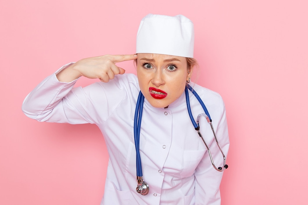 doctor pointing her finger to her head