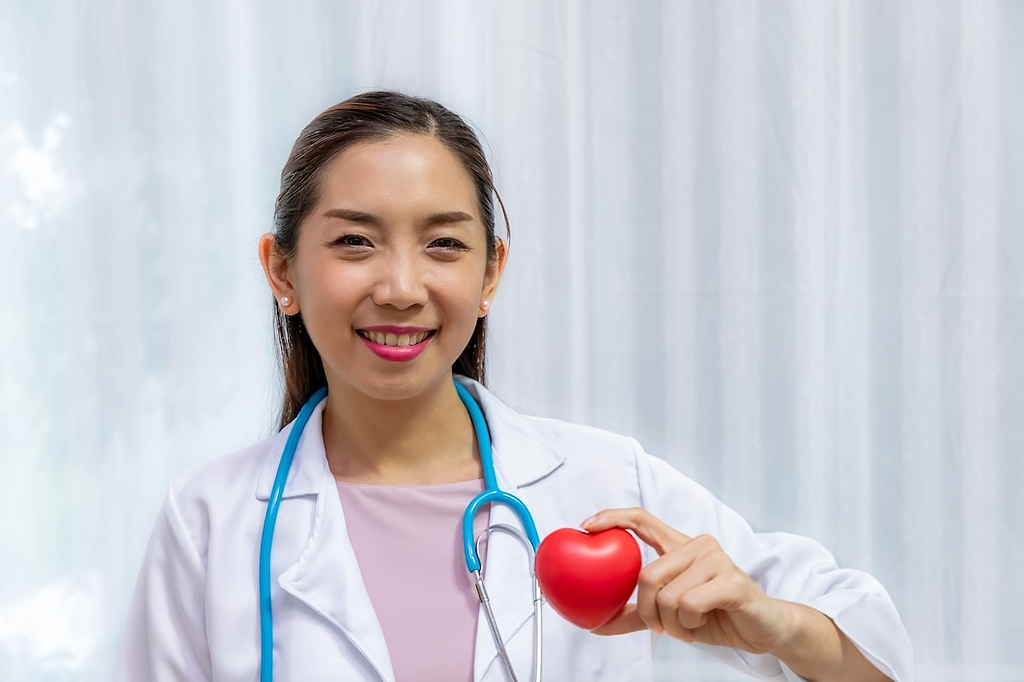 doctor holding a stuff toy heart