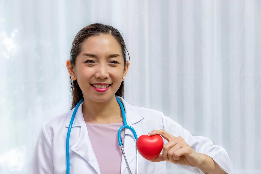 doctor holding a stuff toy heart