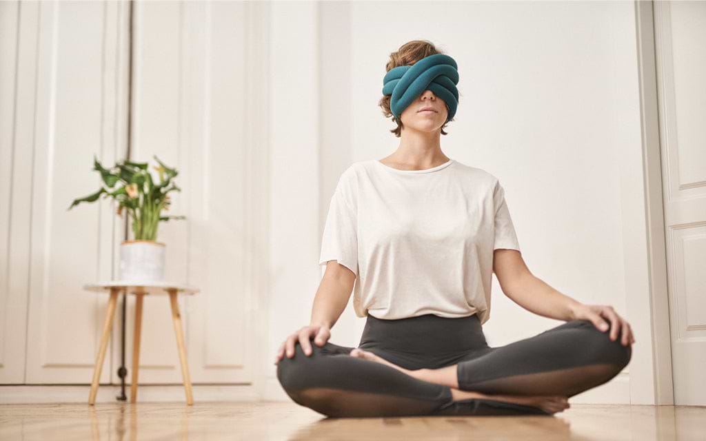 Girl using Loop Eye Pillow by Ostrichpillow