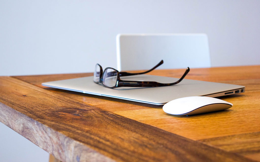 Pair of glasses on a computer