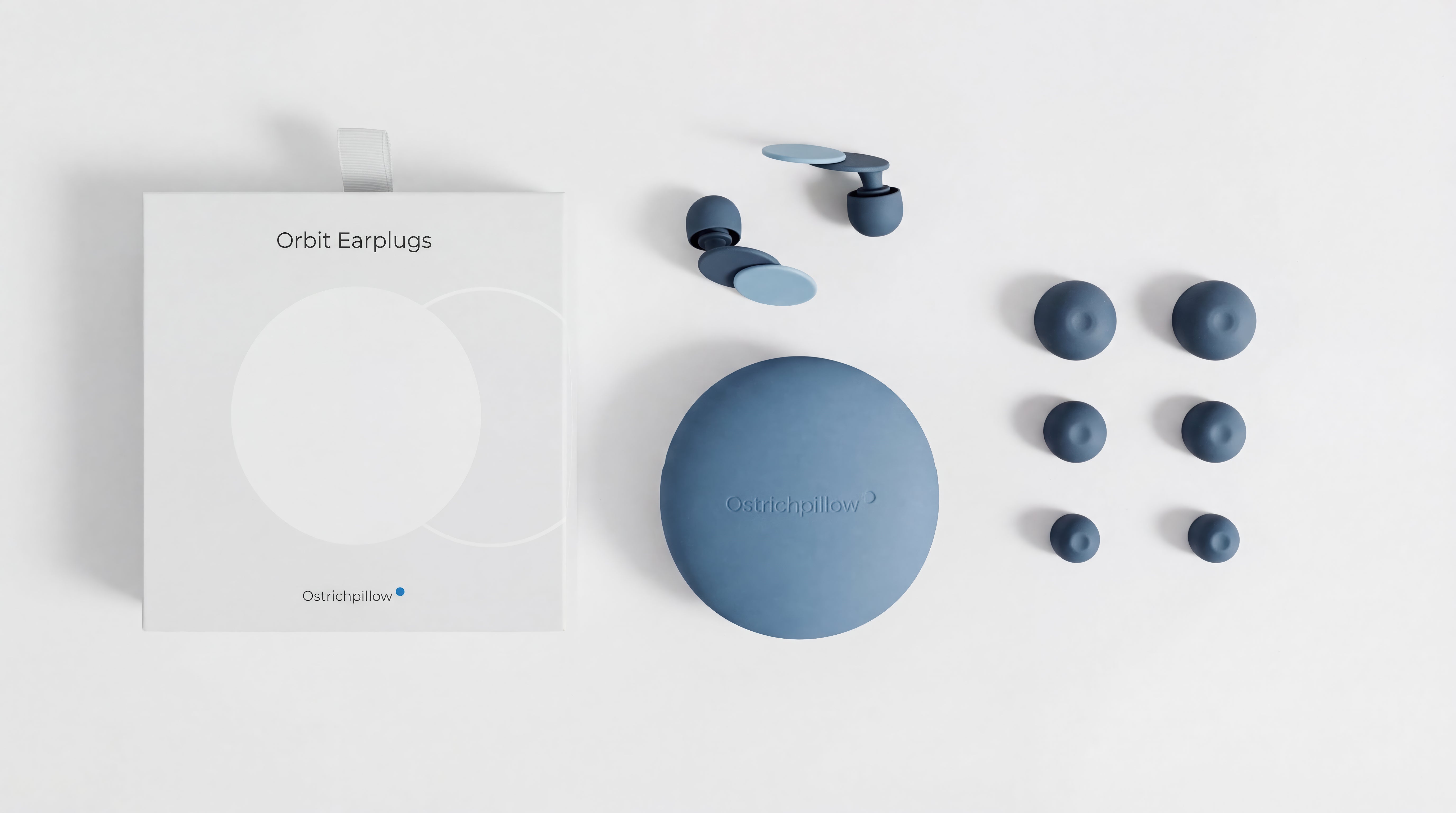 Orbit Earplugs packaging flat-lay showing silicone case and silicone earplugs.