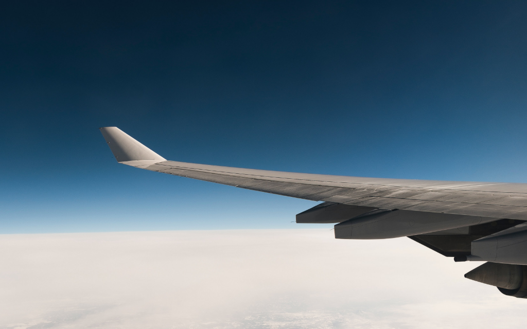 Plane flying over clouds