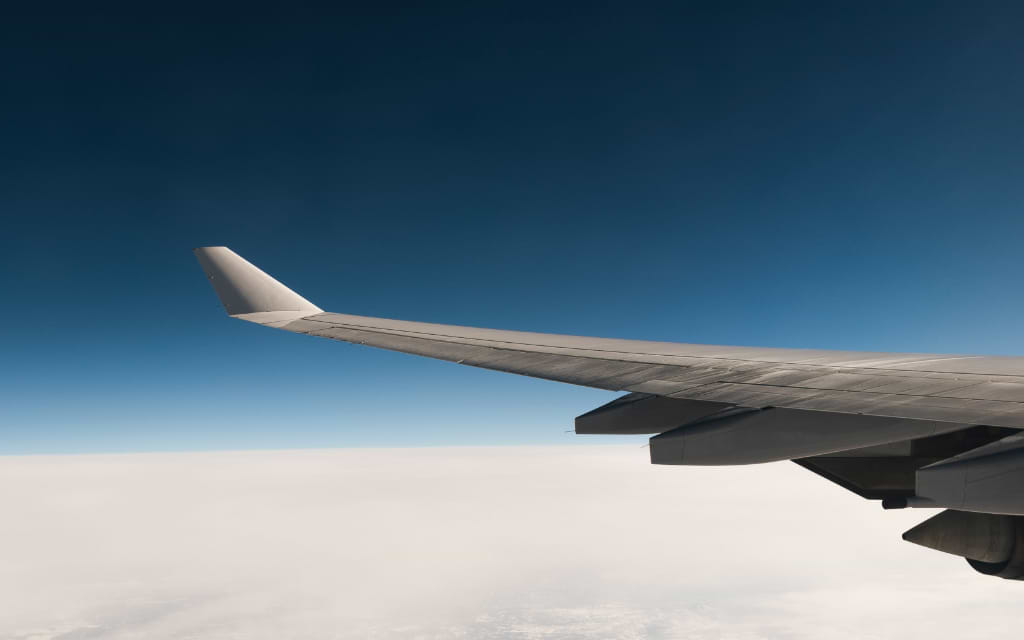 Plane flying over clouds