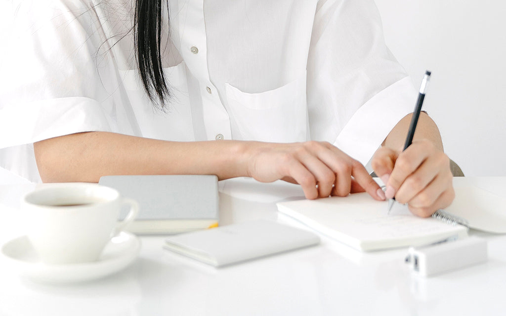 Writing on a notebook