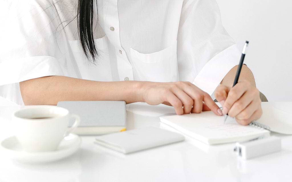 Writing on a notebook