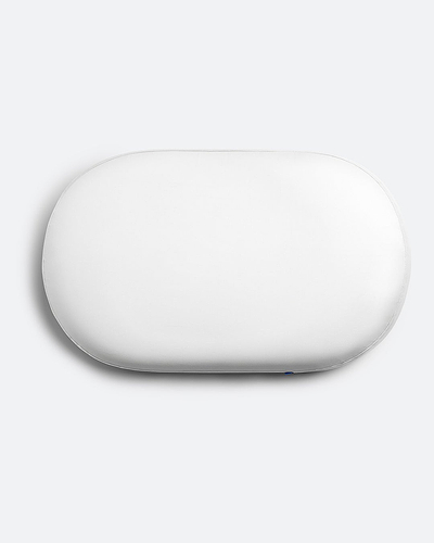 Overhead product shot of the contoured Ostrichpillow memory foam Bed Pillow in Powder White, showing its unique supportive shape.