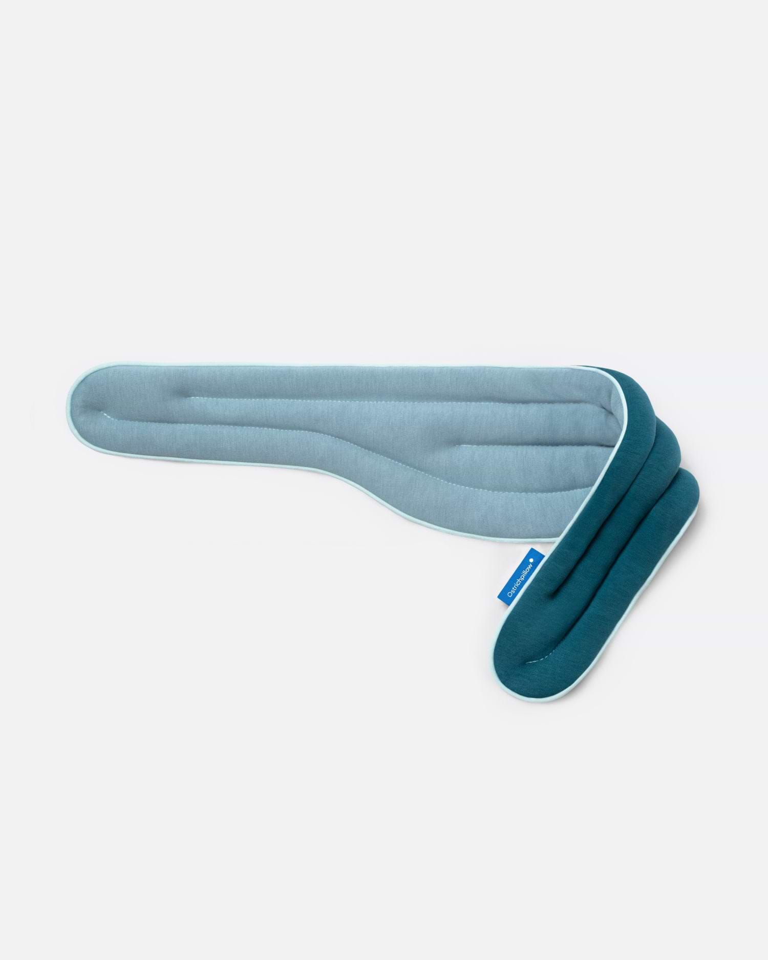 Heated Neck Wrap in 'Ocean Blue', showcasing its reversible color sides featuring a slate blue fabric on one side and a navy blue on the other.