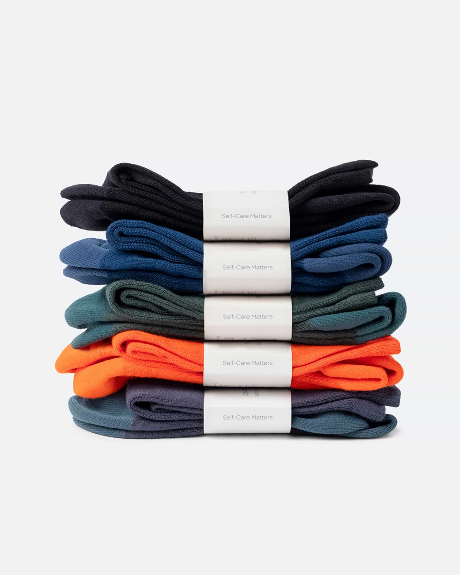Display of Bamboo Compression Socks showing variety of tones like Black Eclipse, Seaside Siesta, Blue Reef Caribbean Green, Sunset Red and Night Walk.