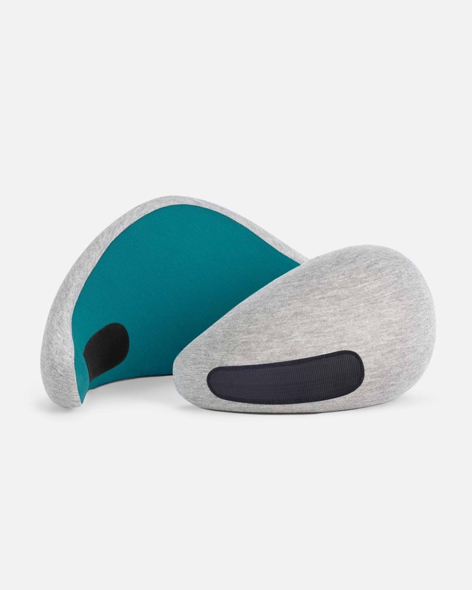 The Go Neck Pillow in the color Blue Reef, an ergonomic travel pillow that features a light grey outer fabric with a deep teal inner lining.