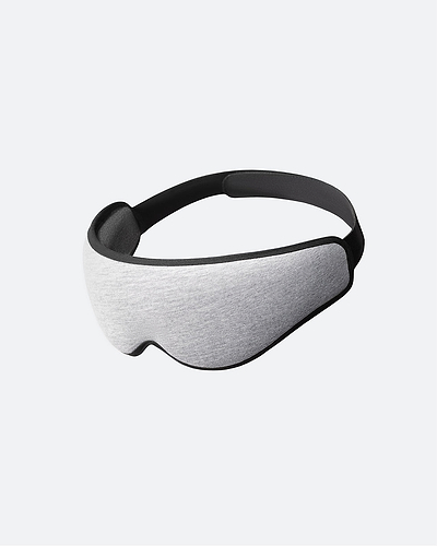The Eye Mask in Midnight Grey. The ergonomic sleep mask features a light grey front panel framed by a black border edge.