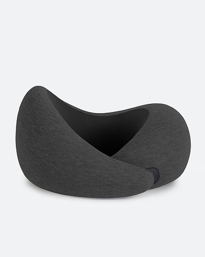 The Go Neck Pillow in the color Dark Knight, which features a charcoal grey outer fabric and a black inner lining.