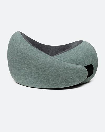 The Go Neck Pillow in the color Green Moss, which has a sage green outer fabric and a charcoal grey inner lining, fastened by its adjustable strip.