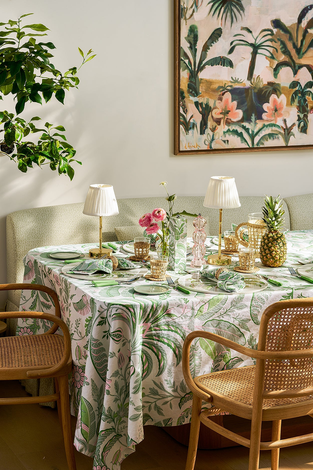 Palm Beach Collection tablescape with green tablecloth, matching napkins and gold bamboo lamps