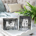 Photo frames on a large white lacquer tray