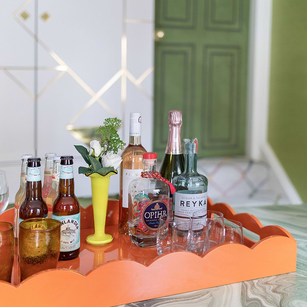 Drinks served on a large orange lacquer tray