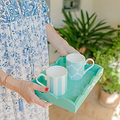 Drinks served on a small turquoise blue lacquer tray 