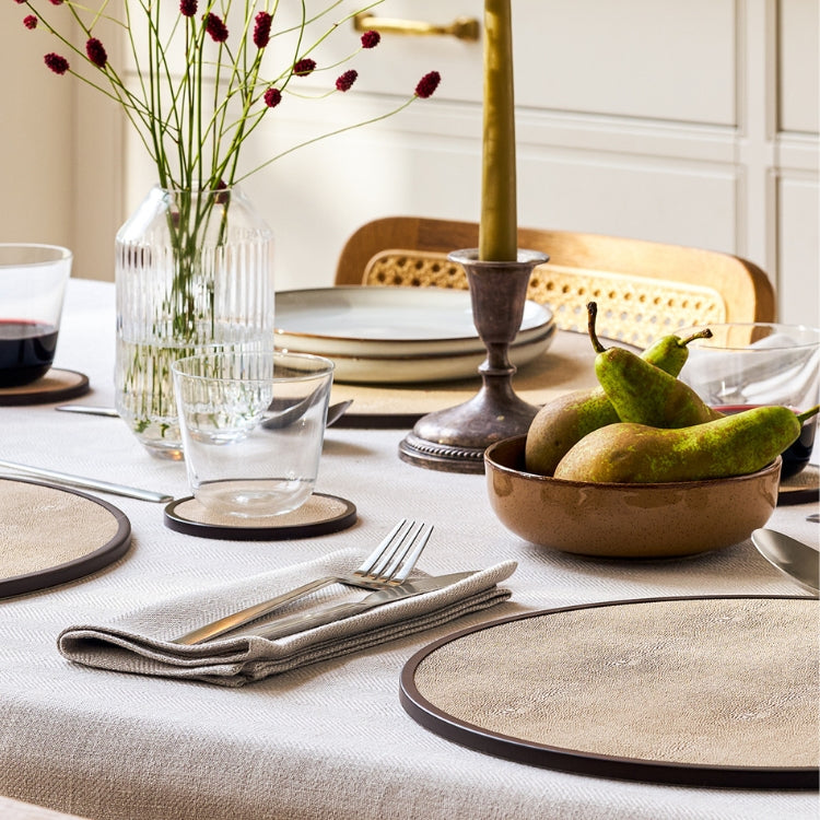 Table set with placemat, coasters and salt and pepper mills for dining table styling