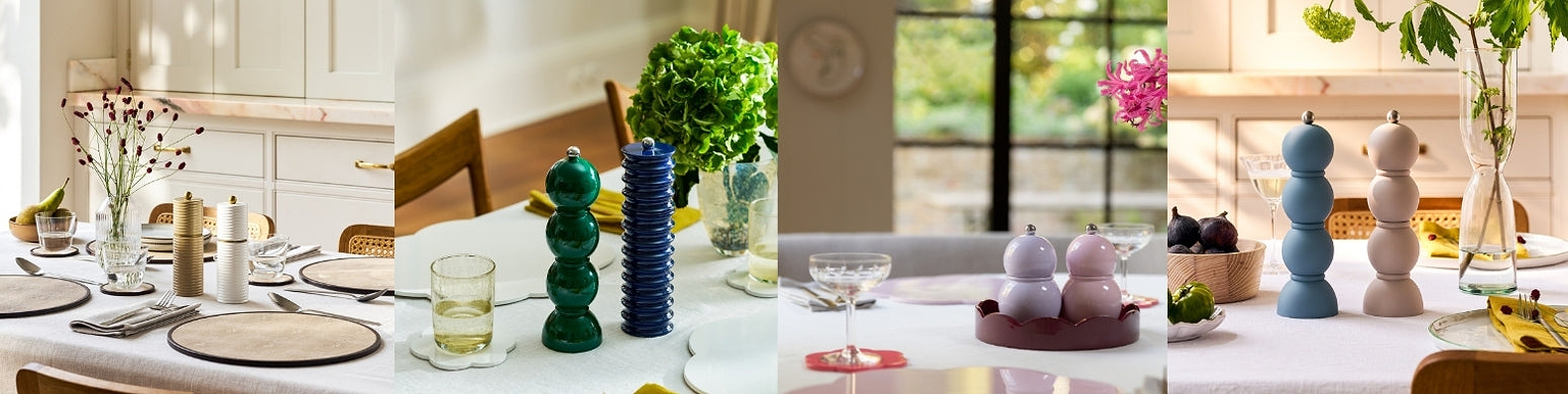 Salt and pepper mills styled as statement pieces on a dining table