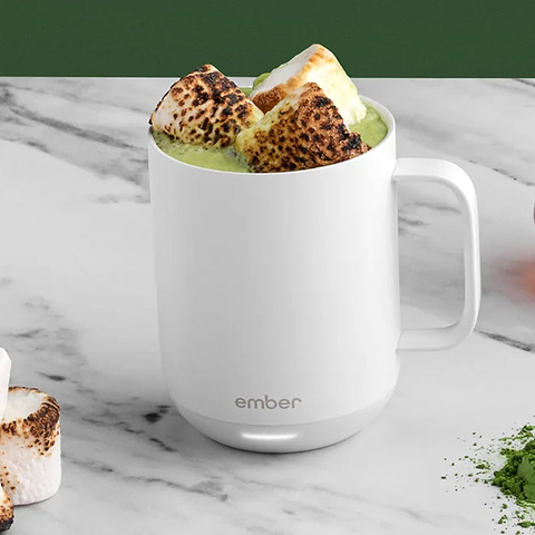 A white Ember Mug is filled with warm matcha and scorched marshmallows.