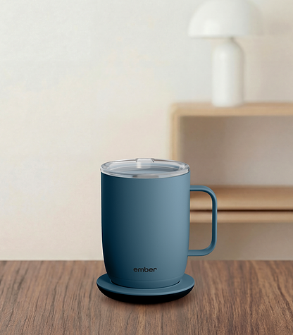 Ember Mug 3 in Salt Blue, 14 oz, on a desk