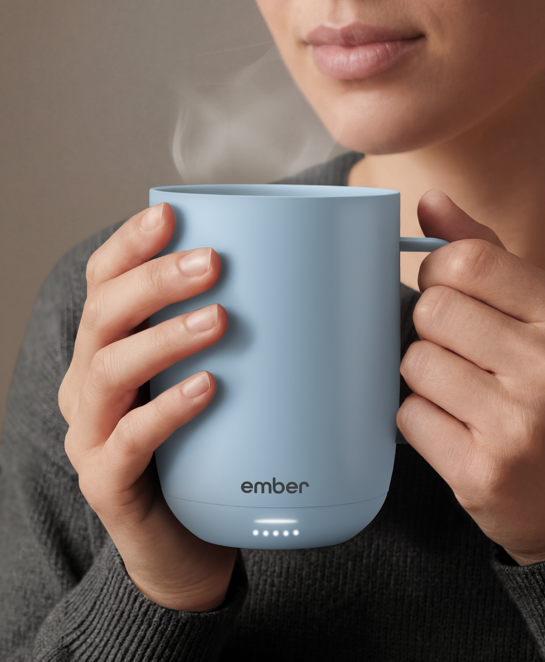 Ember Mug 3 in Powder Blue, 14 oz, held in hands