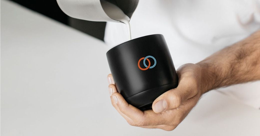 Customized Ember Mug being filled with coffee