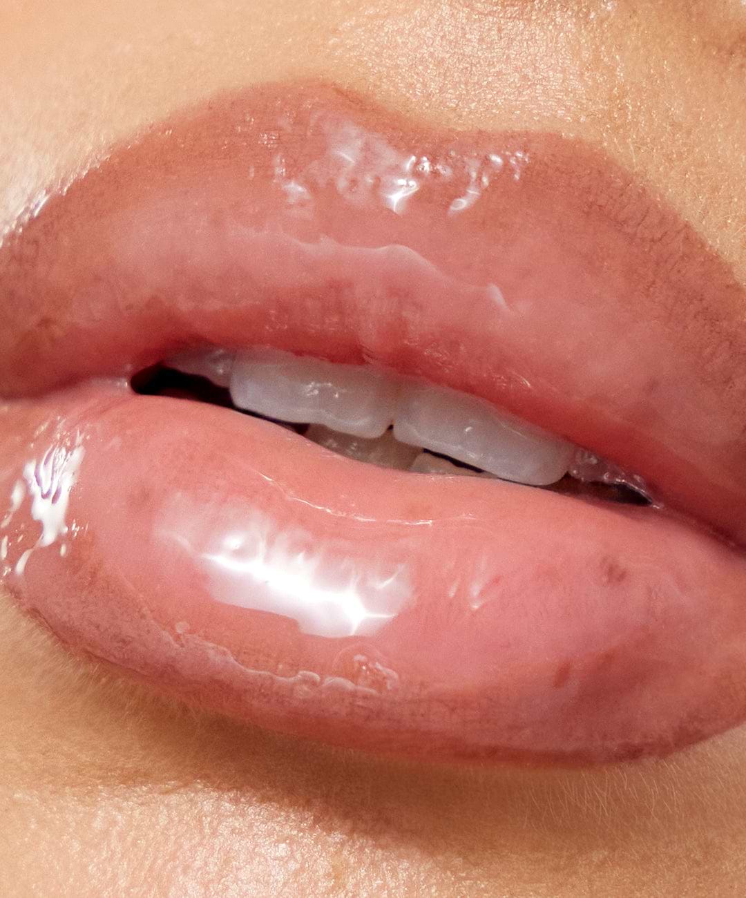 | desc: Model wears Lip Sculpt & Lip Gloss in Taupe