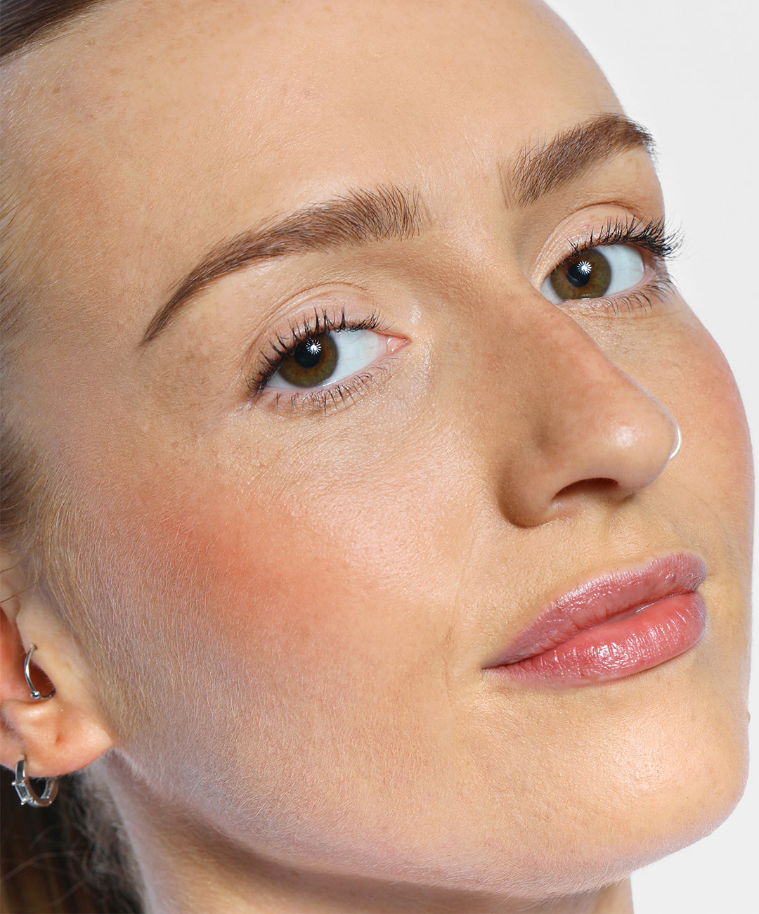 Chloe wears Brow Pencil in Medium