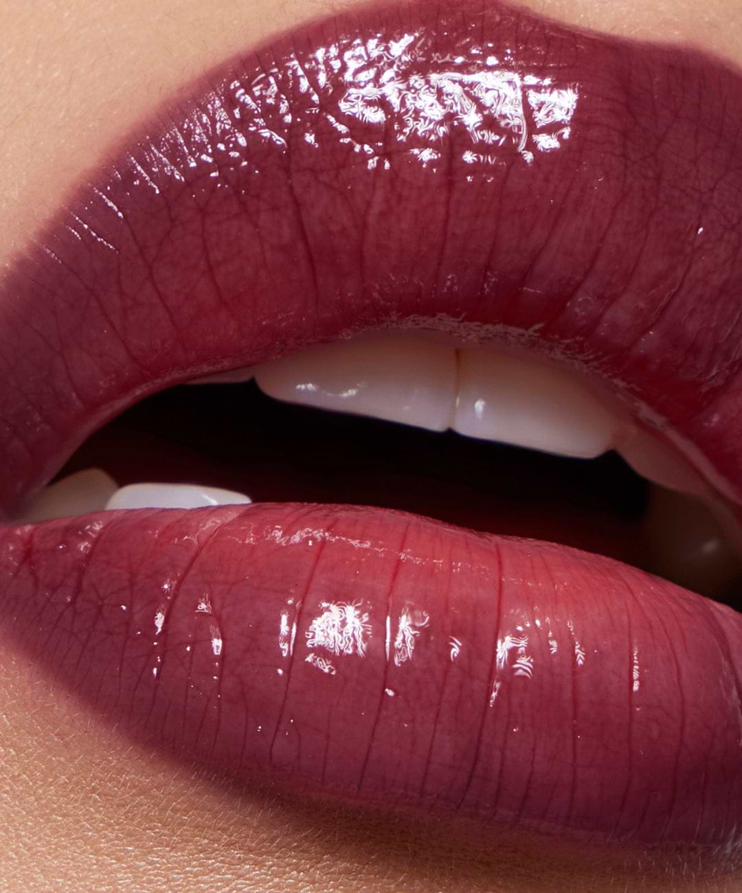 | desc: | text: light Lip Gloss in Plum