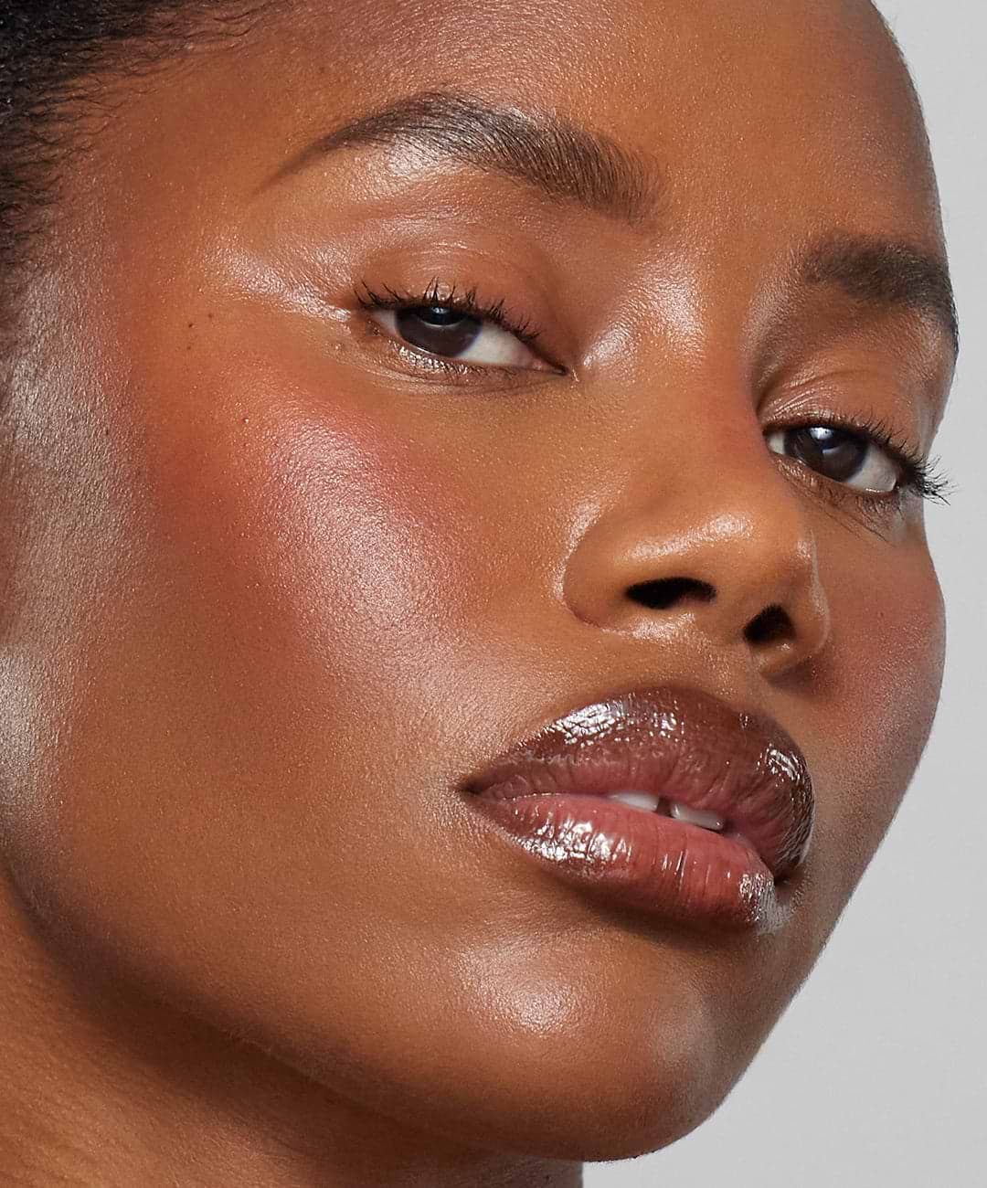 Model wears Lip Sculpt & Lip Gloss in Sepia