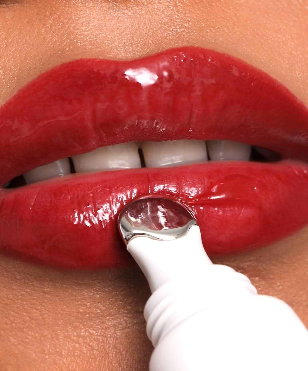 model wears REFY Lip Gloss in Red