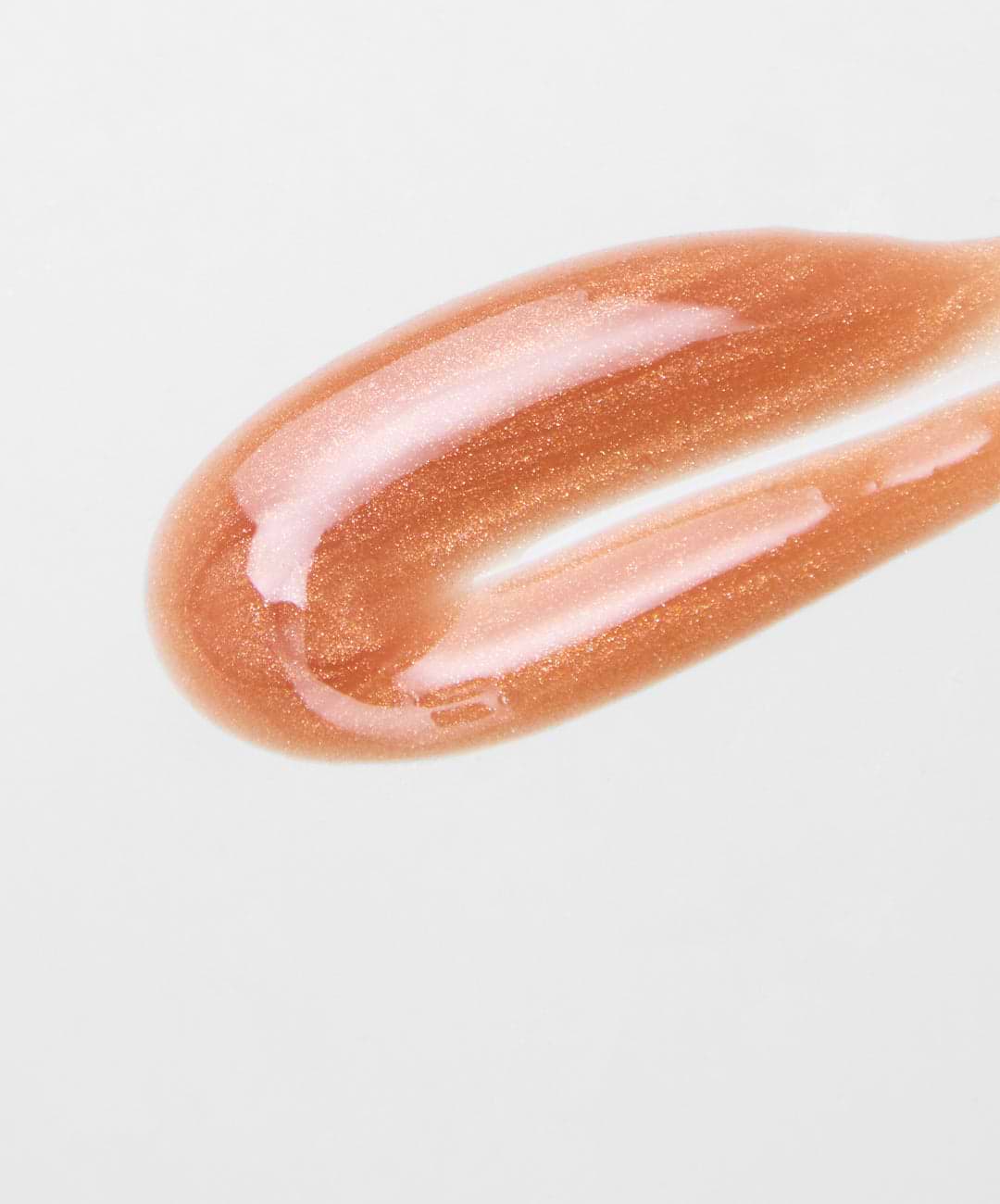 swatch of REFY lip gloss in topaz, with golden shimmer