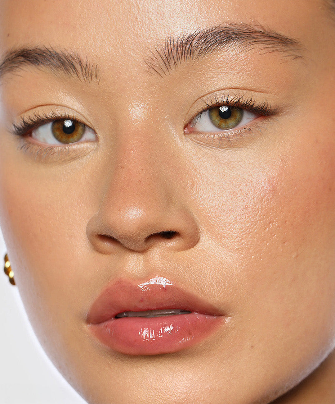 | desc: Cesca wears Lip Gloss in shade Rosewood