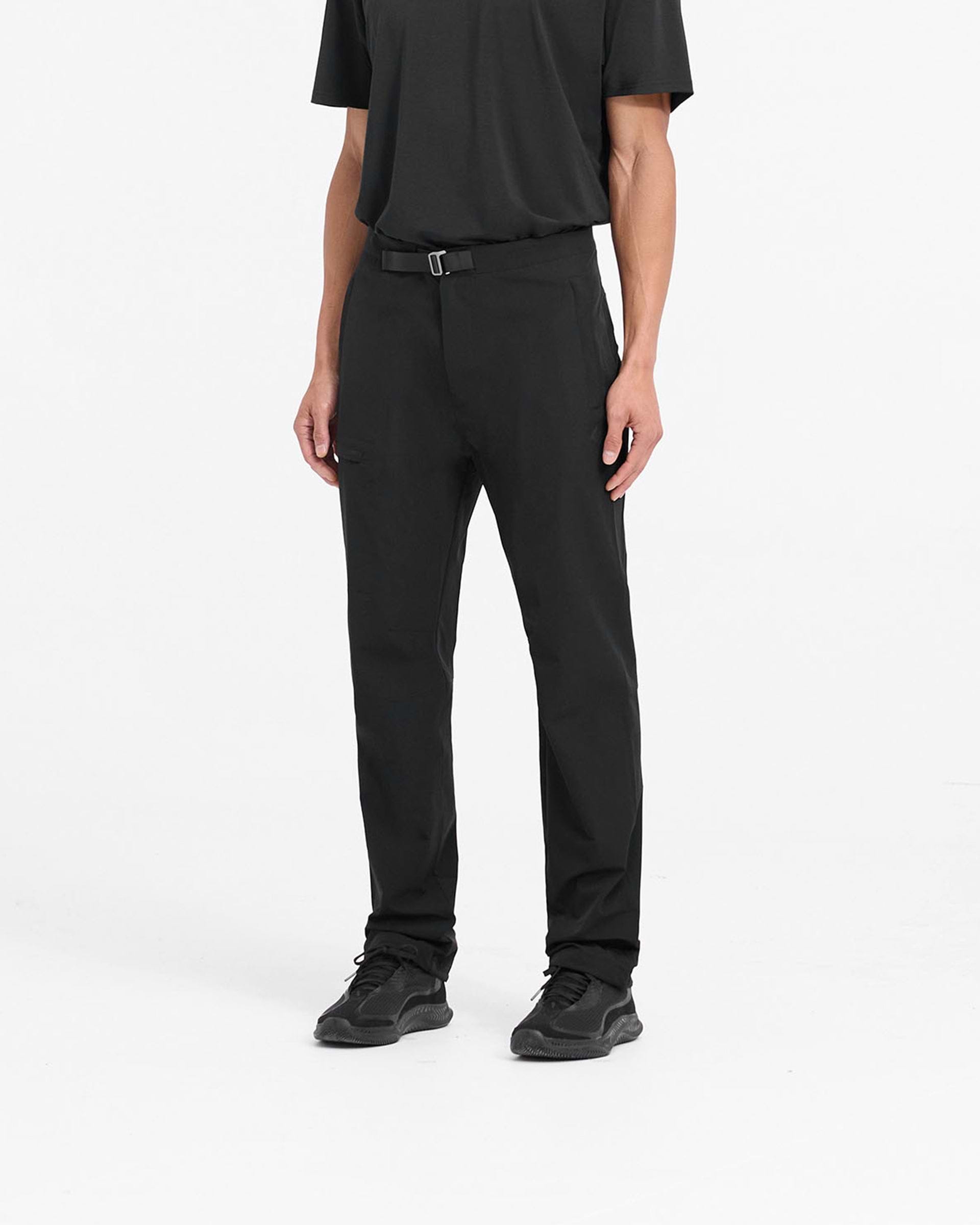 Back product image of mens black pants on a plain white background | 247 Mission Pant in Black | Stretch nylon pants with zip pockets and built-in belt | 247 Pants | Represent Clo