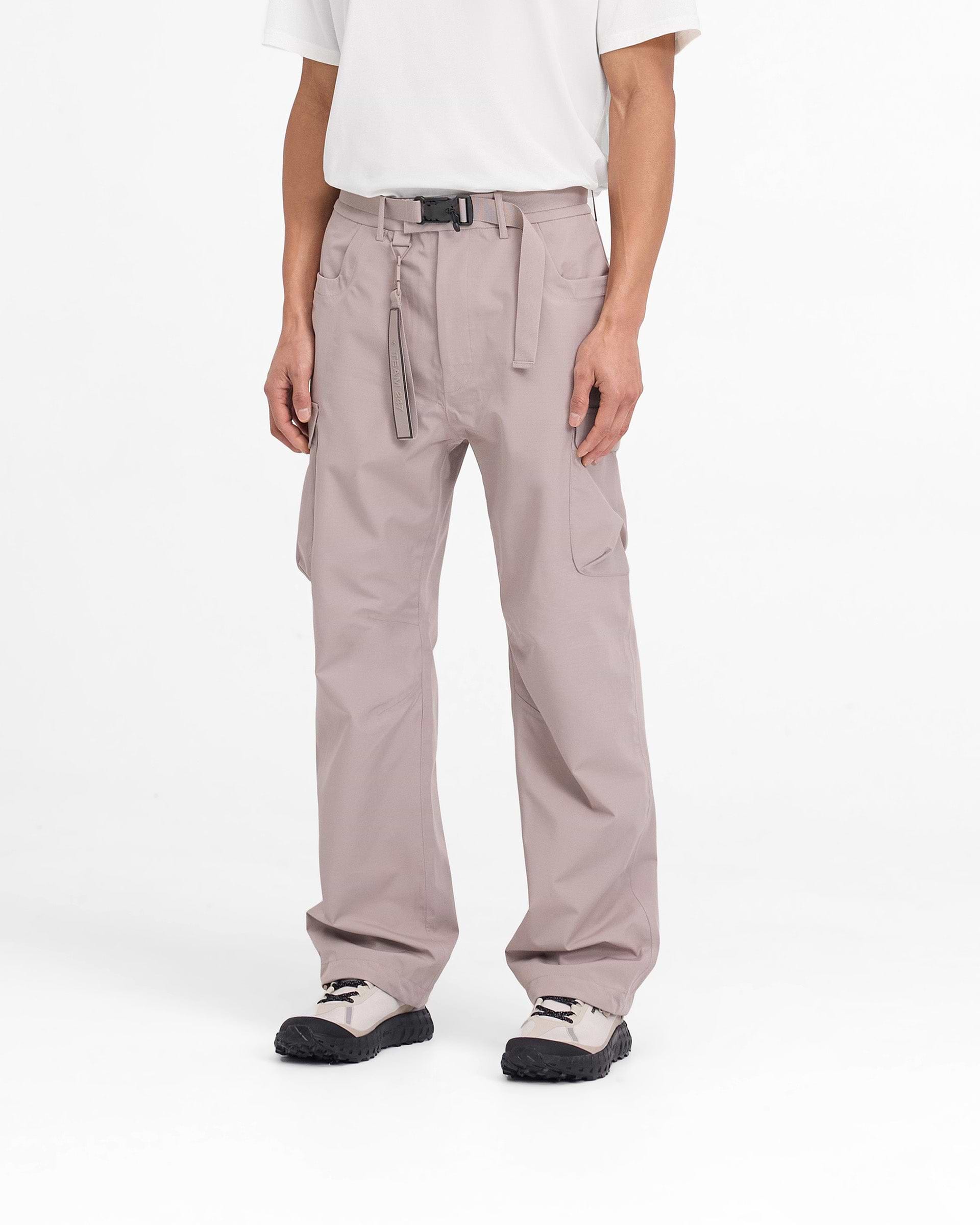 Back product image of mens grey cargo pants on a plain white background | 247 Technical Cargo Pant in Moonrock | Showerproof straight leg cargo pants | 247 Pants | Represent Clo