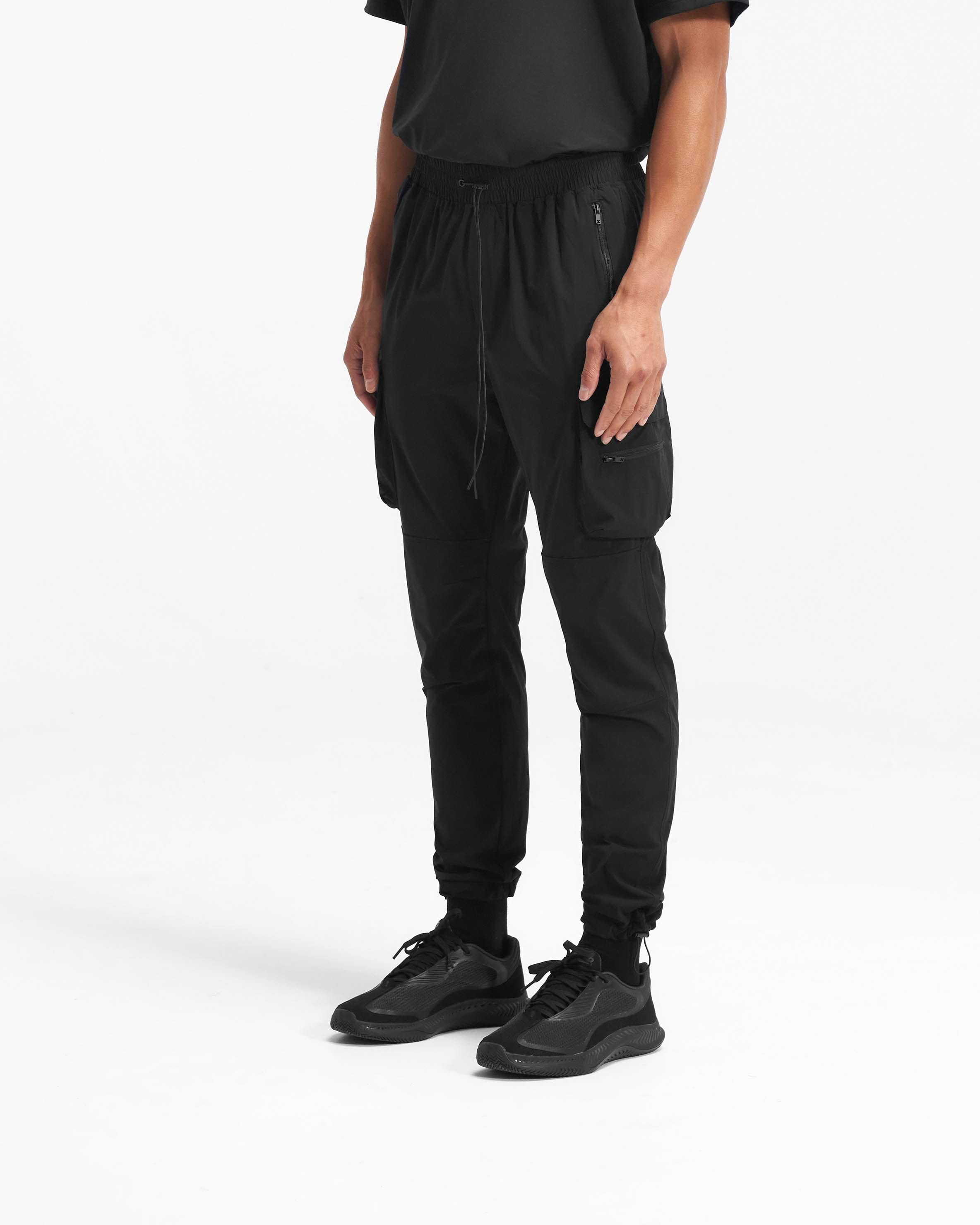Back product image of mens black pants on a plain white background | 247 Pant in Black | Cargo pants with dual cargo pockets and adjustable details | 247 Pants | Represent Clo