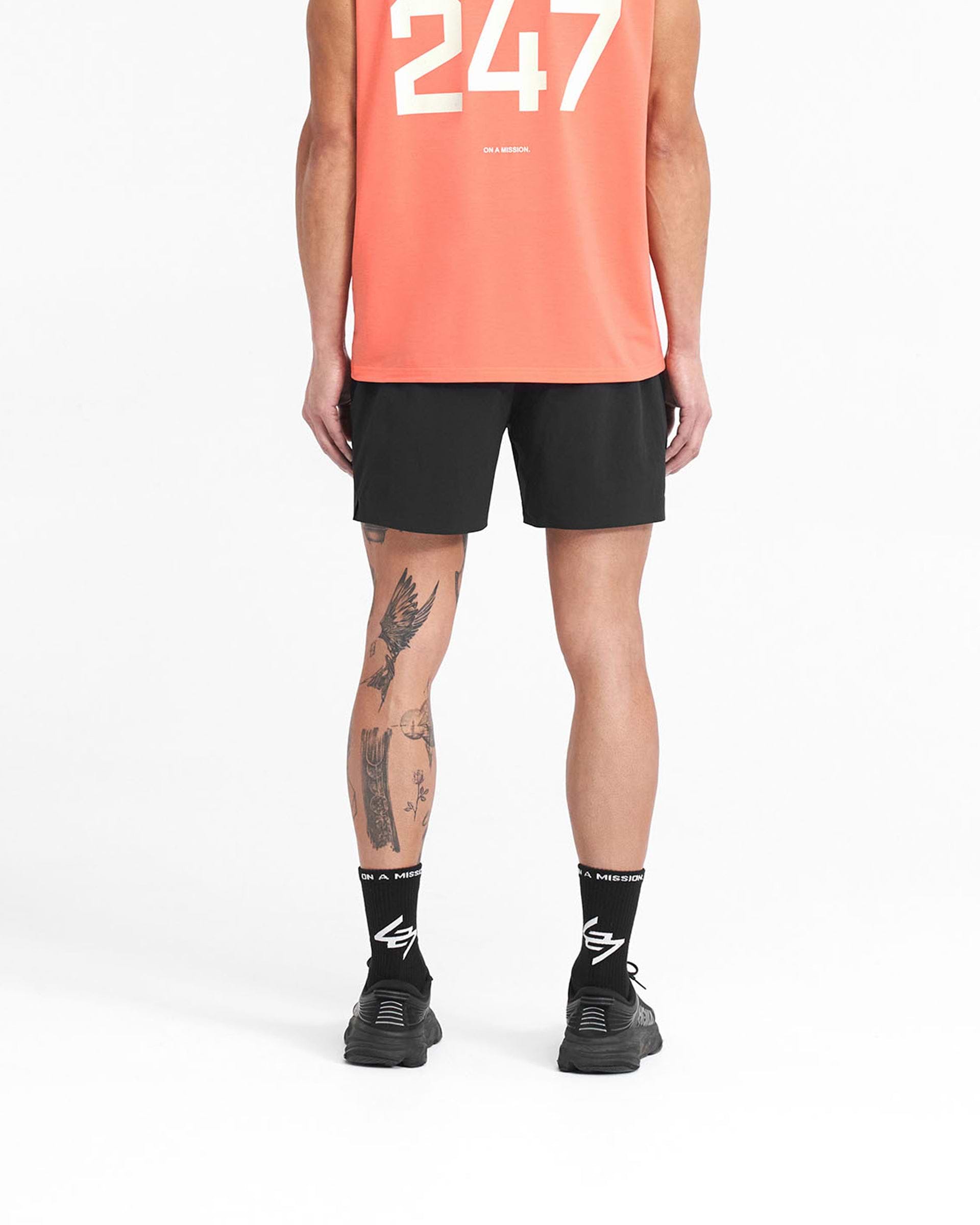 Man wearing black gym shorts on a plain white background | 247 Fused Shorts in Black | Gym shorts with 4 way stretch and internal drawcord | 247 Shorts | Represent Clo