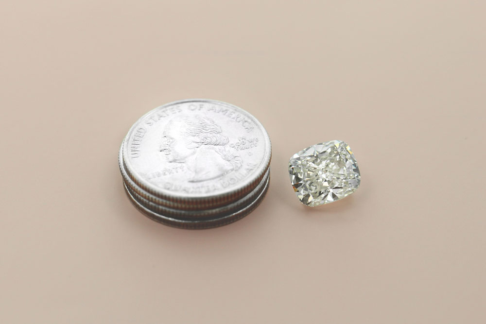 the 6.28 carat lab grown diamond compared to a US quarter