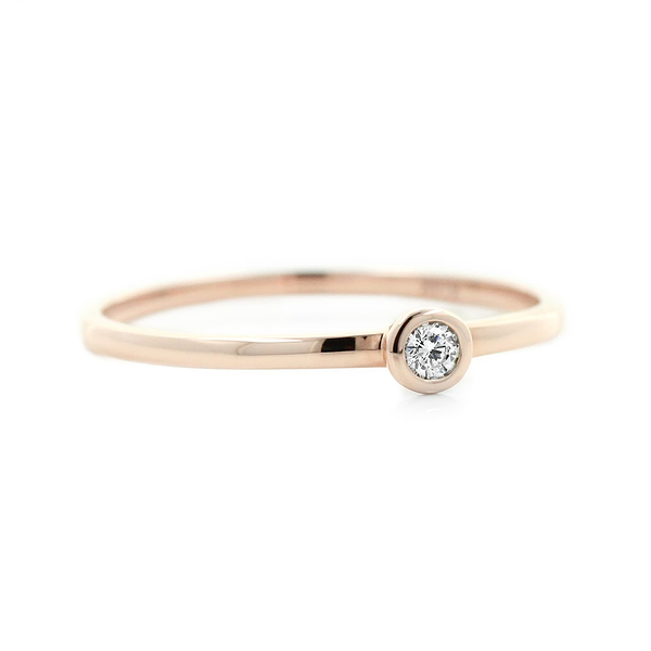 Stackable band with small bezel set recycled diamond in 14k rose gold