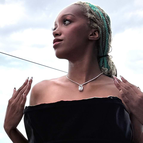 Model Briana Raye wears MiaDonna Diamonds and an Evan Hirsch gown, on the Starchild Rooftop