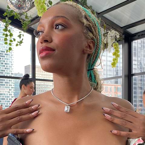 Model Briana Raye prepares to wear the 21 Carat MiaDonna Grown Diamond and 9 Carat Weight Lab Diamond Tennis Necklace at Evan Hirsch's NYFW presentation