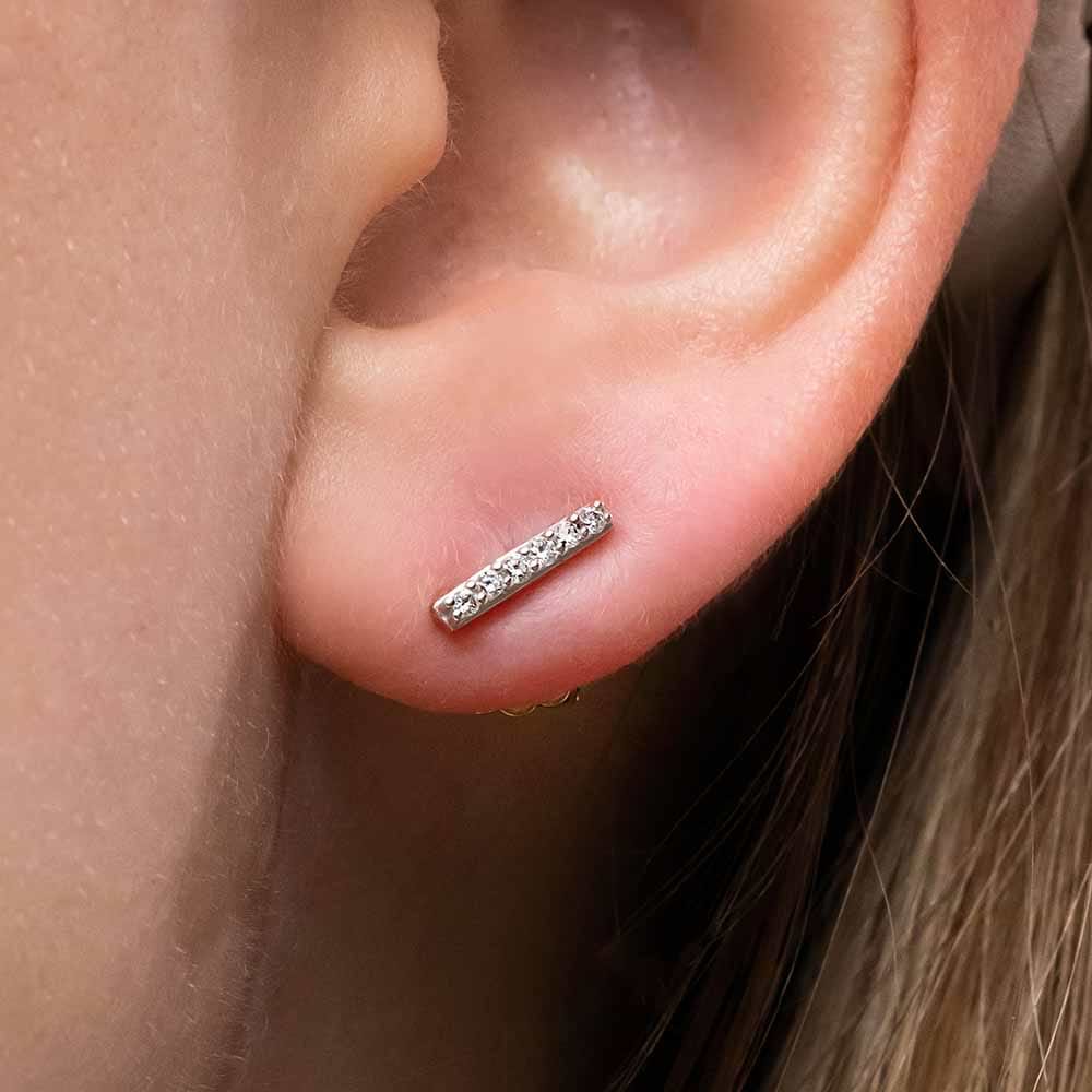 Diamond Bar earrings set with 0.10ctw Lab Grown Diamonds, and measure 8.8mm (length) by 1.8mm (width) in 14K White, Yellow, or Rose Gold.