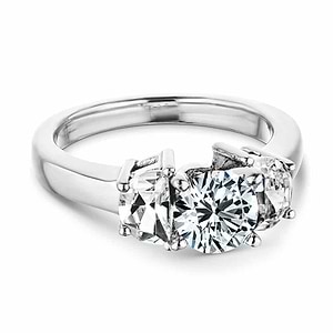 Beautiful three stone engagement ring with 1ct round cut lab grown diamond with half moon cut diamond side stones in 14k white gold