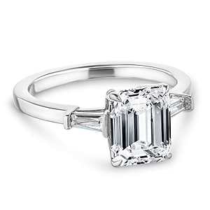 Baguette side stone engagement ring with 1ct emerald cut lab grown diamond in 14k white gold with peek-a-boo diamonds