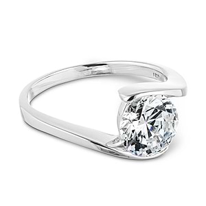 Modern minimalistic sleek engagement ring with a 2ct round cut lab grown diamond in a 14k white gold band that gives the illusion of a tension setting
